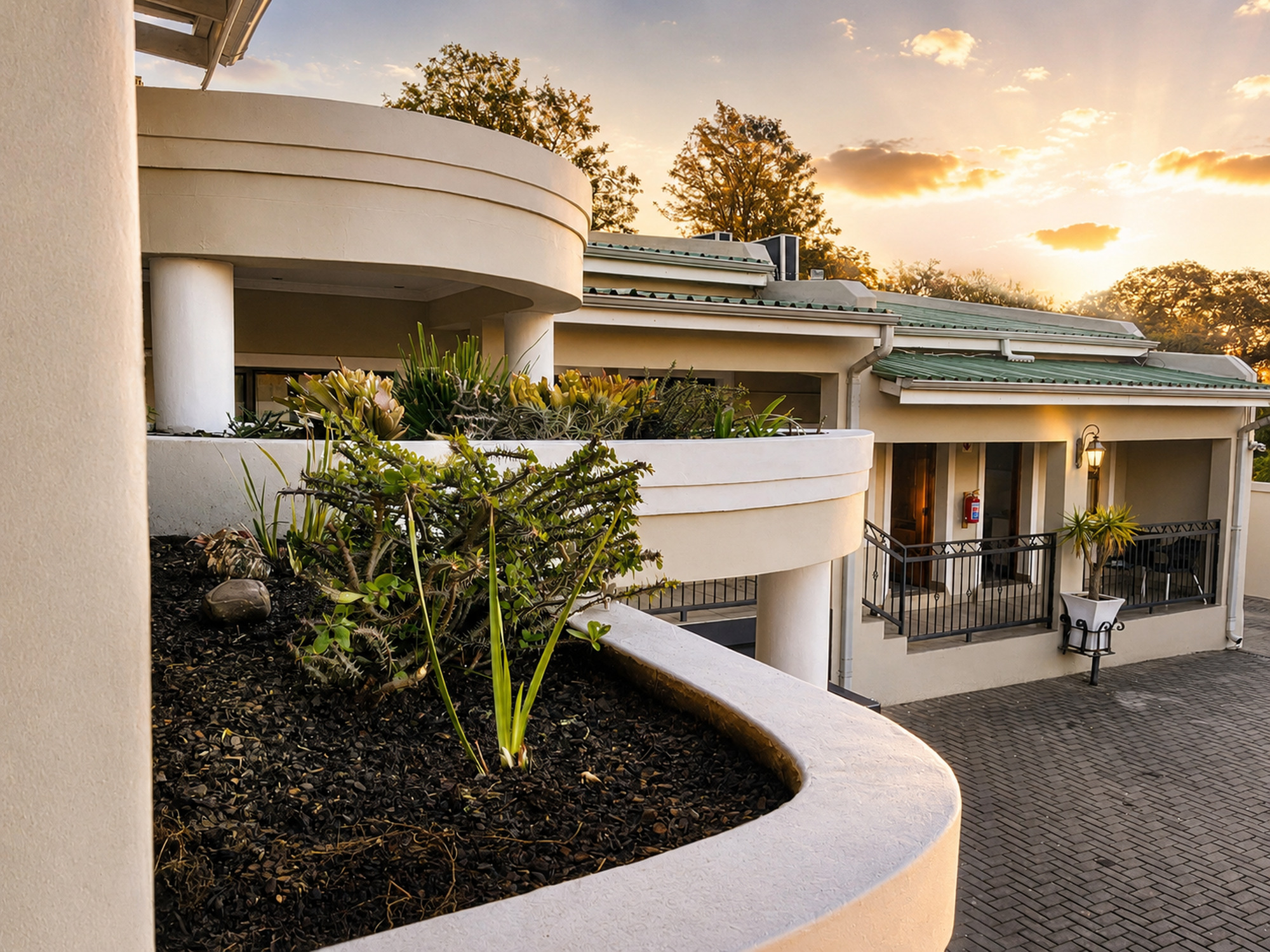 Le Pearl Boutique Hotel courtyard at sunset
