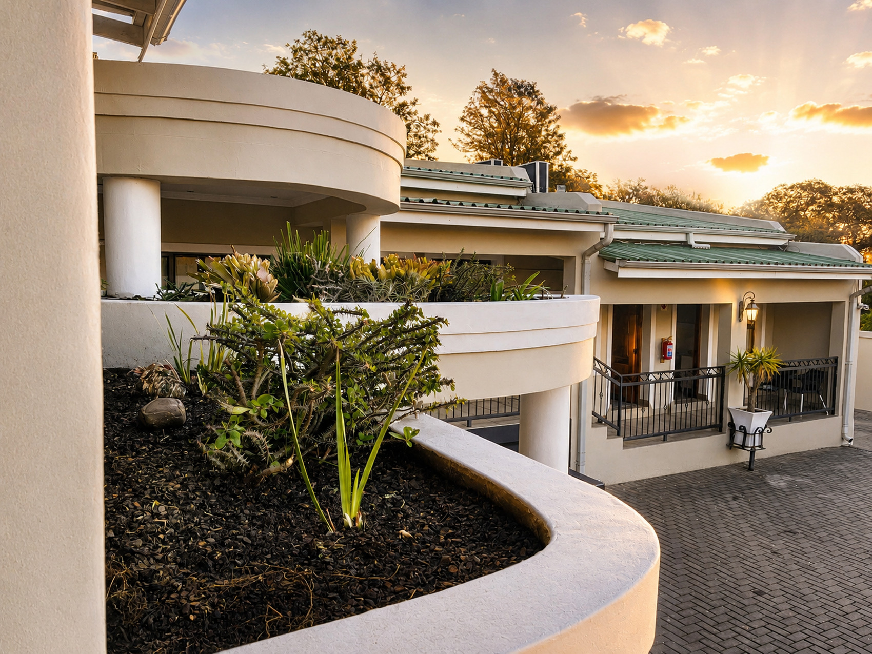 Le Pearl Boutique Hotel courtyard at sunset