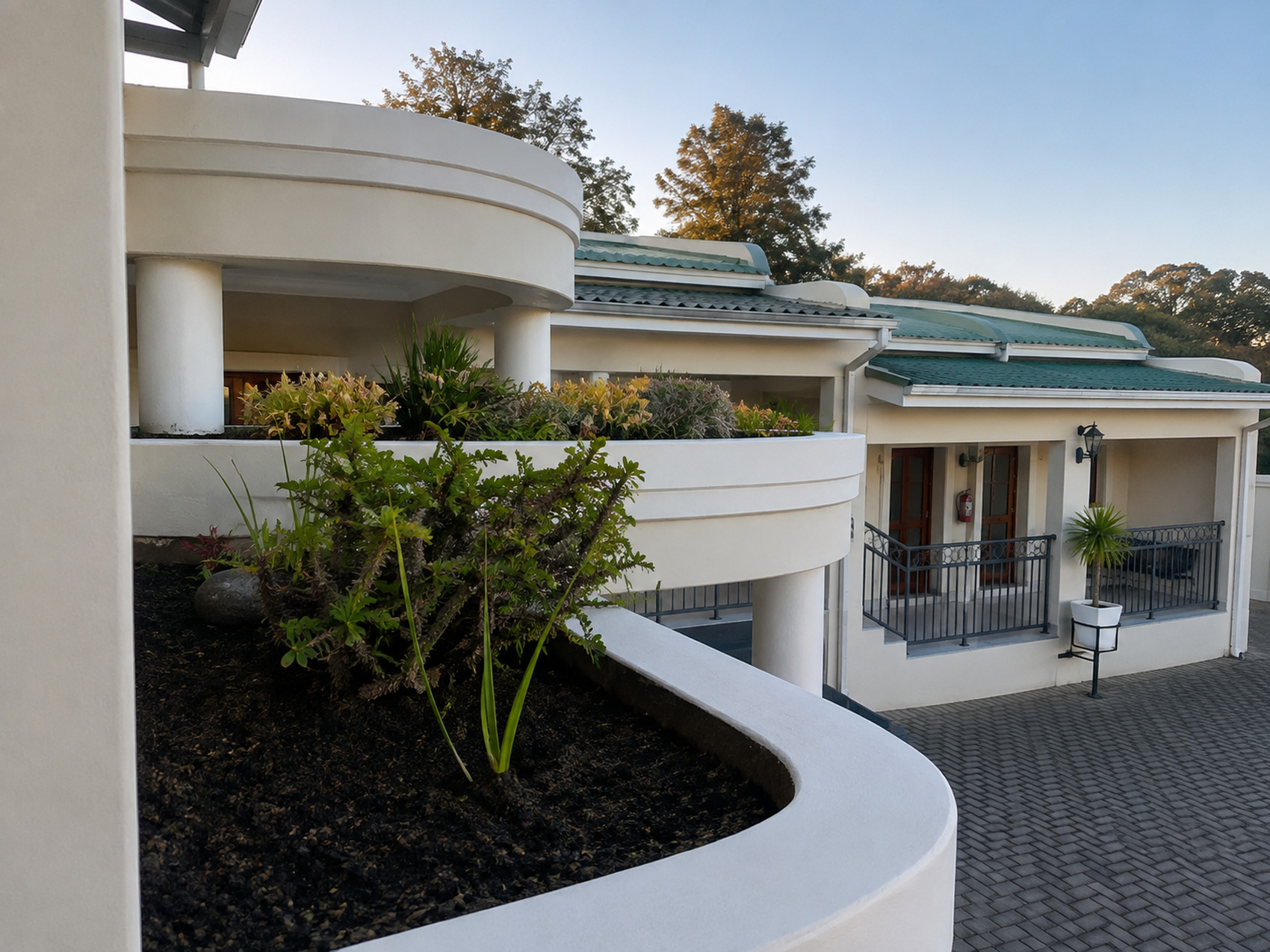 Le Pearl Boutique Hotel courtyard and landscaped exterior